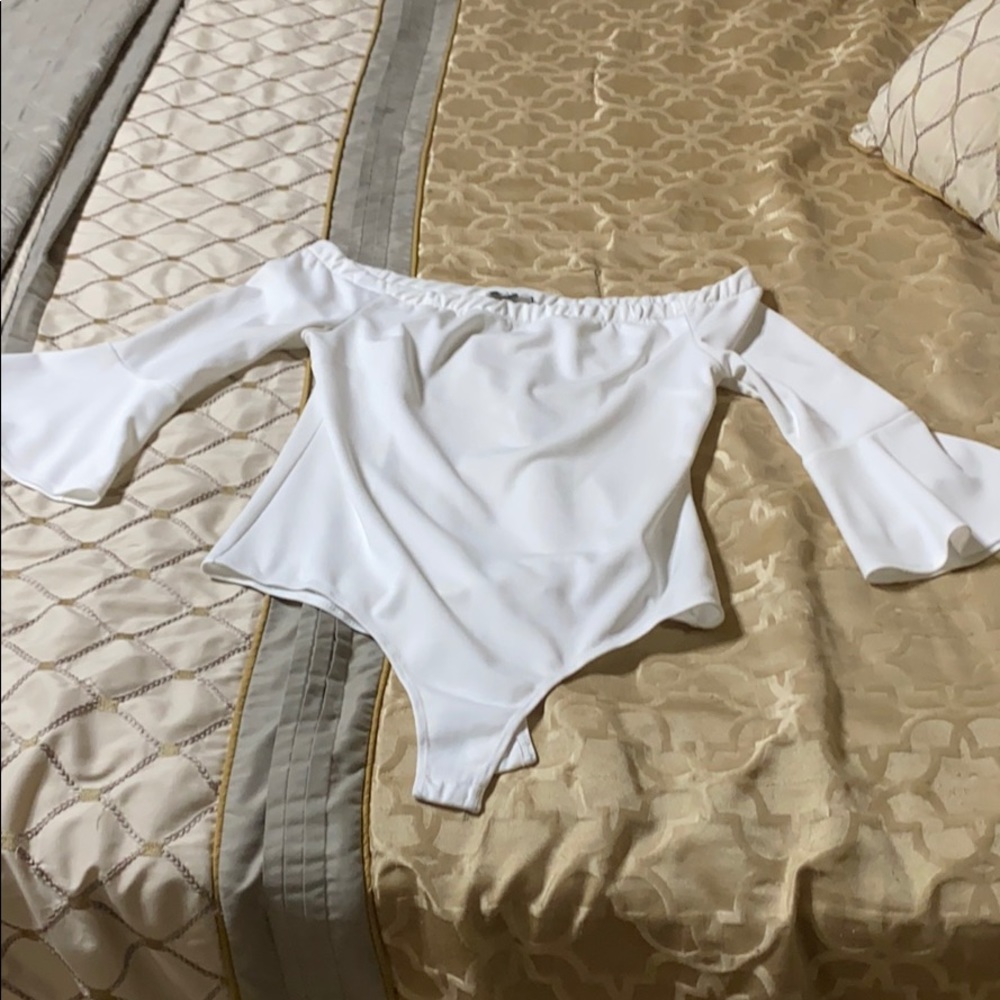 White Medium body suit with bell sleeve.